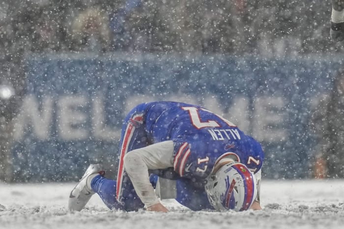 Buffalo Bills quarterback Josh Allen (17) remains down after a hard hit from Cincinnati Bengals cornerback Mike Hilton (21) in the fourth quarter of the NFL divisional playoff football game between the Cincinnati Bengals and the Buffalo Bills, Sunday, Jan. 22, 2023, at Highmark Stadium in Orchard Park, N.Y.